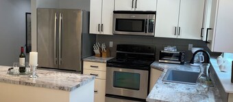 New 2 bedroom suite with private parking and entrance steps away from beach