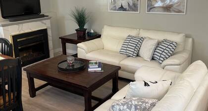 New 2 bedroom suite with private parking and entrance steps away from beach