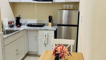 Fridge, microwave, stovetop, coffee/tea maker