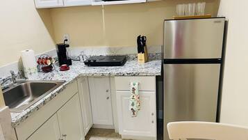 Fridge, microwave, stovetop, coffee/tea maker