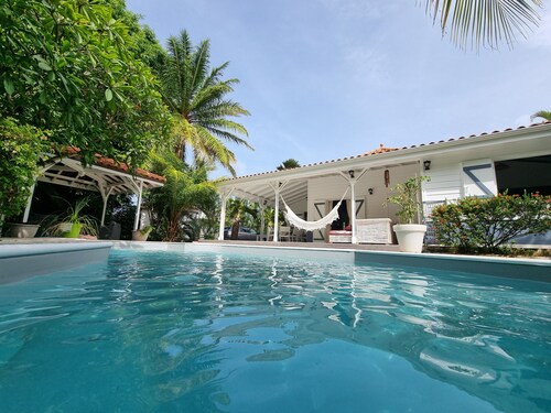 Creole villa with pool, between turquoise sea and tropical garden