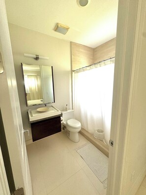 Bidet, towels, soap, toilet paper