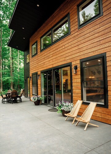 Modern mountain- inspired monoslope home located in the beautiful Northwoods