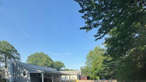A residential property with a detached garage, a covered patio, and a fenced yard. - Looking for a clean place to rest that won’t break the bank? Nestle offers that. (Woodbridge Township)
