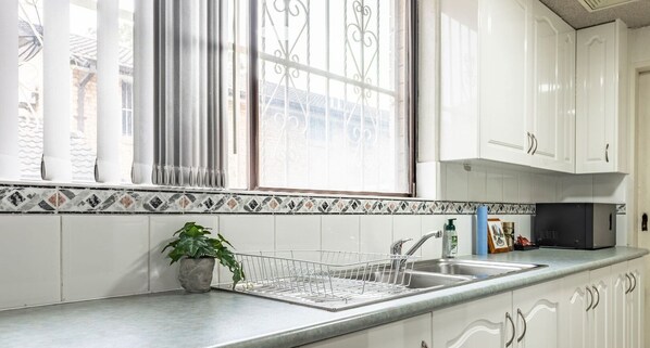 Fridge, microwave, toaster, cookware/dishes/utensils