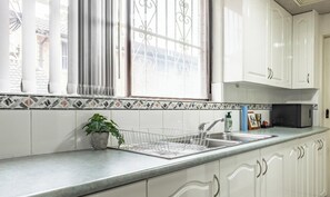 Fridge, microwave, toaster, cookware/dishes/utensils