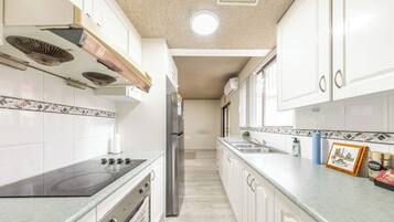 Fridge, microwave, toaster, cookware/dishes/utensils