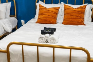 1 bedroom, desk, iron/ironing board, travel crib