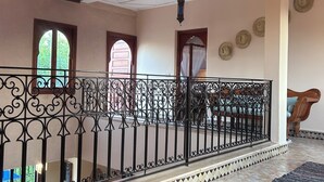 A spacious interior with a balcony, patterned floor tiles, and decorative wall elements. - A haven of peace in Marrakech (Marrakech)