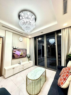 Apartamento superluxo, 1 quarto, sacada, vista para a cidade | Área de estar