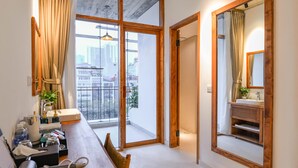 A modern bathroom with a large window, a wooden vanity, and a mirror. - 22 Land 50 Truong Cong Giai Hotel (Hanoi)