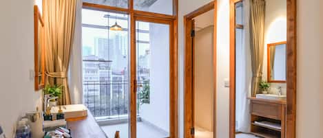 Deluxe Double Room, Balcony, City View | Minibar, in-room safe, individually furnished, desk