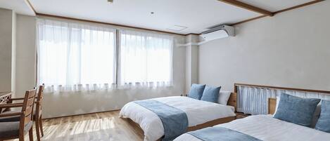 Family Apartment | Desk, bed sheets