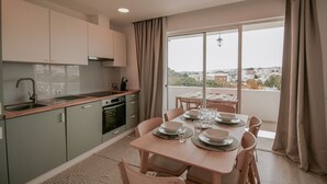 A modern kitchen with a dining area.