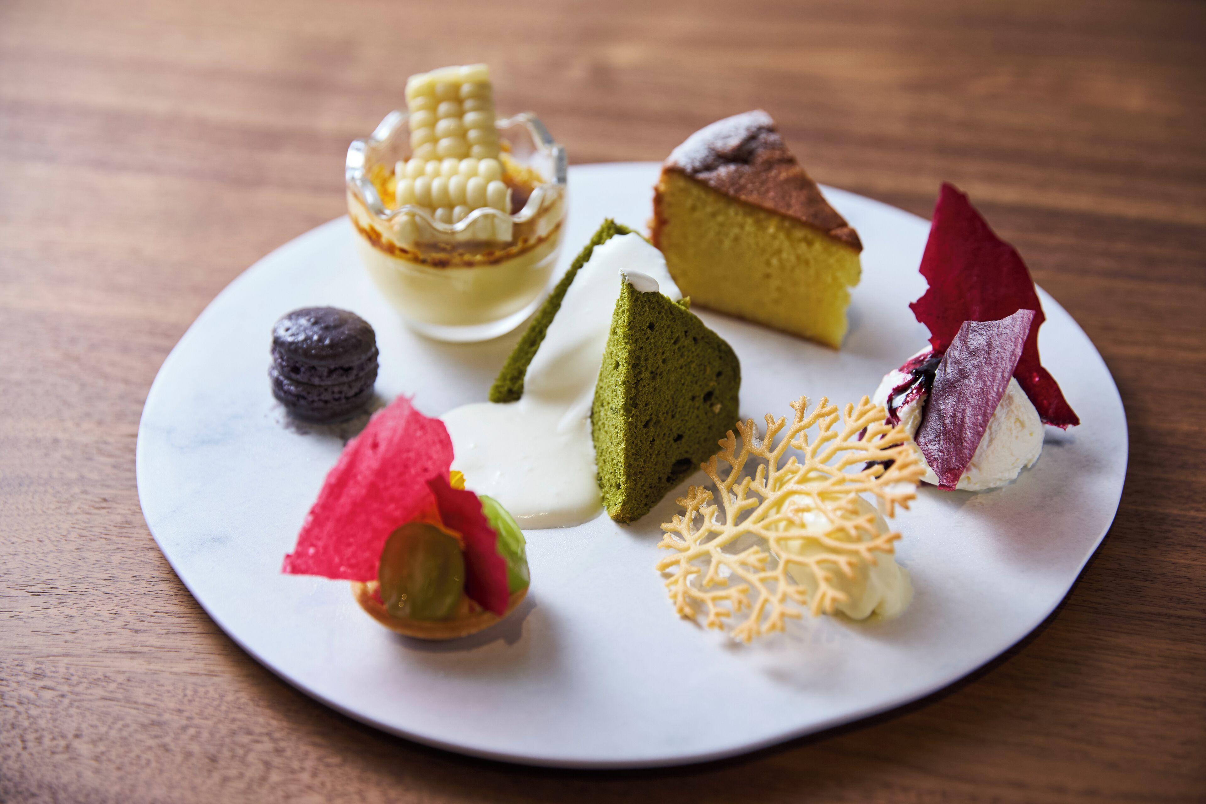 A variety of desserts on a white plate.