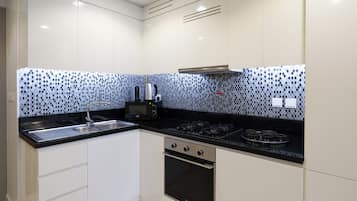Deluxe Apartment, 2 Bedrooms, Balcony, City View | Private kitchen | Microwave, oven, stovetop, espresso maker