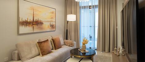 Deluxe Apartment, 2 Bedrooms, Balcony, City View | Living area | 50-cm Smart TV with digital channels