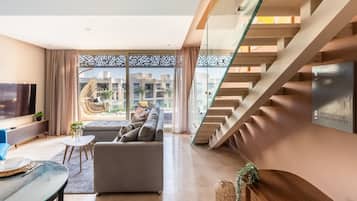 Appartement | Coin séjour | TV connectée de 55 pouces avec chaßnes par cùble, services de streaming