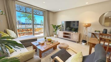 Sparky & Summery 2 BDR @ Mangroovy | Free Beach & Pool Access (M3-3A-04) | Living area | 55-inch Smart TV with cable channels, streaming services