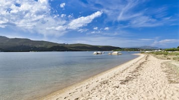 On the beach, sun-loungers