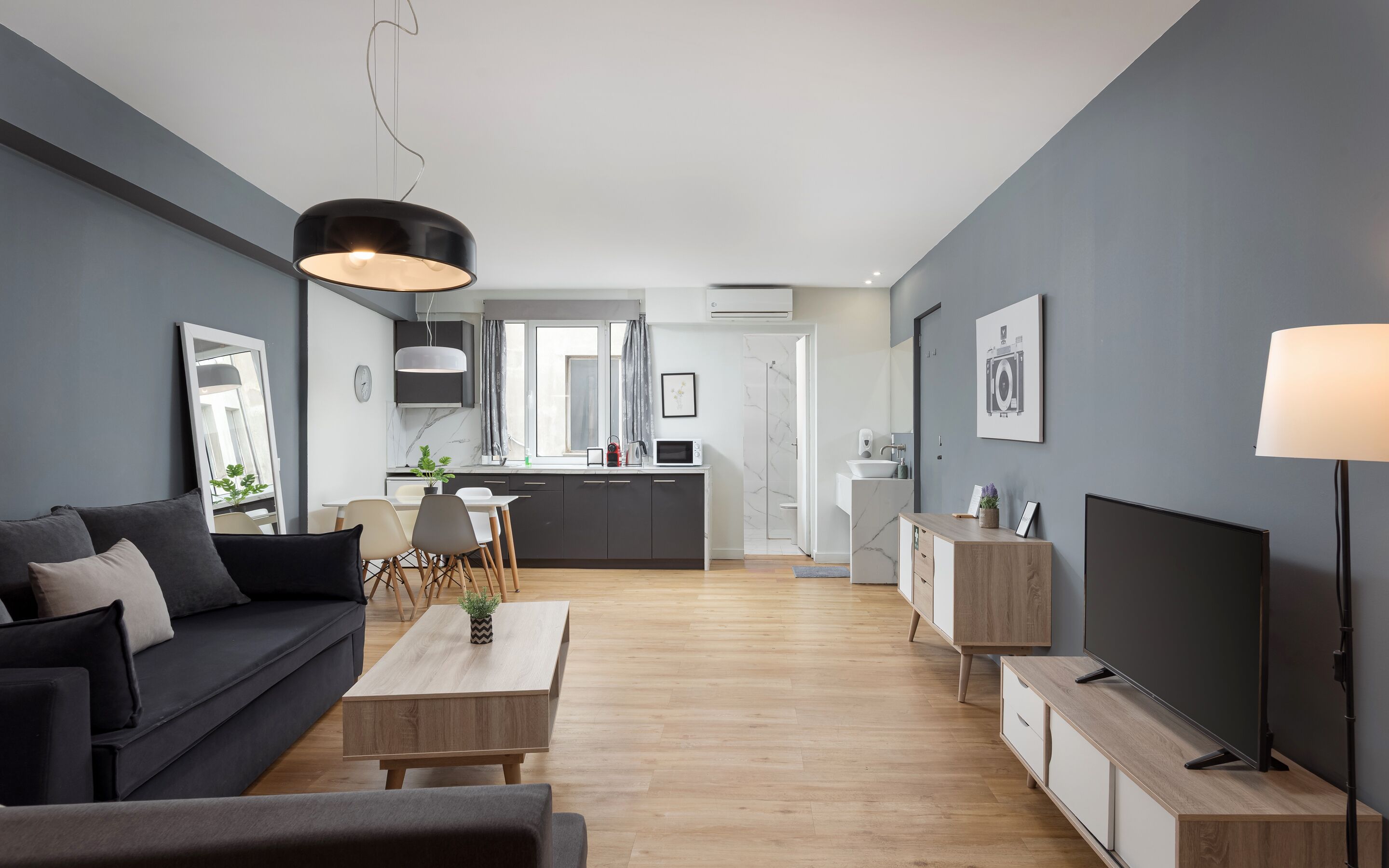 Comfort Suite | Living area | 50-inch Smart TV with satellite channels, Netflix, streaming services