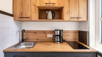 Fridge, microwave, stovetop, coffee/tea maker