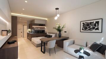 Luxury Apartment, 1 Double Bed, Balcony, City View | Living area | 47-inch TV with cable channels