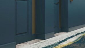 A hallway with dark blue walls, recessed lighting, and a marble floor. - GULFSTREAM HOTEL, Lake Worth Beach, a Tribute Portfolio Hotel (Lake Worth)