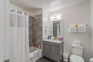 Shower, hair dryer, towels