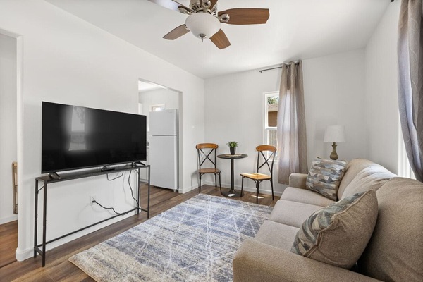 A cozy and inviting living room adorned with plush furnishings perfect for relaxation and gatherings with loved ones.