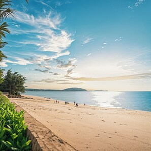 Private beach, white sand, beach umbrellas, kayaking