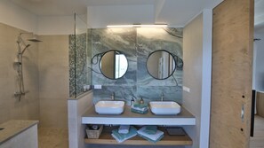 Shower, eco-friendly toiletries, hair dryer, towels