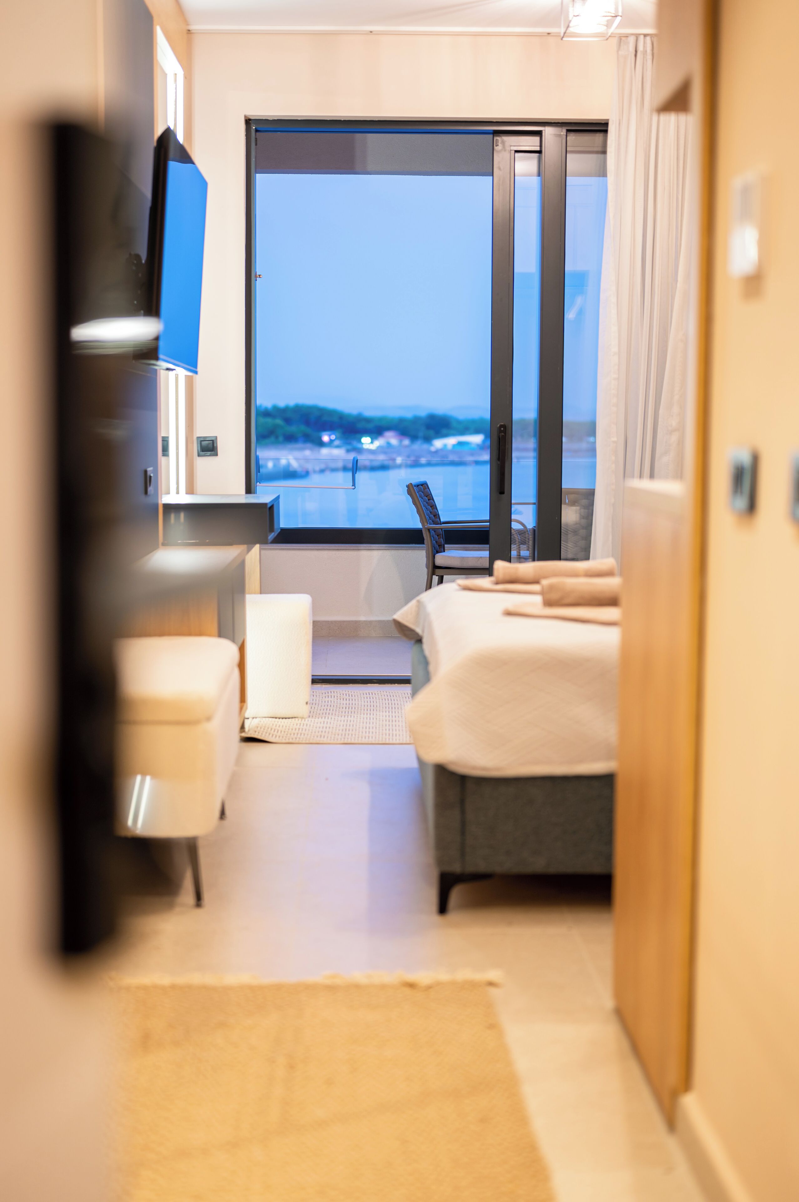 Premium bedding, memory-foam beds, laptop workspace, soundproofing