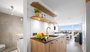 Fridge, stovetop, dishwasher, coffee/tea maker