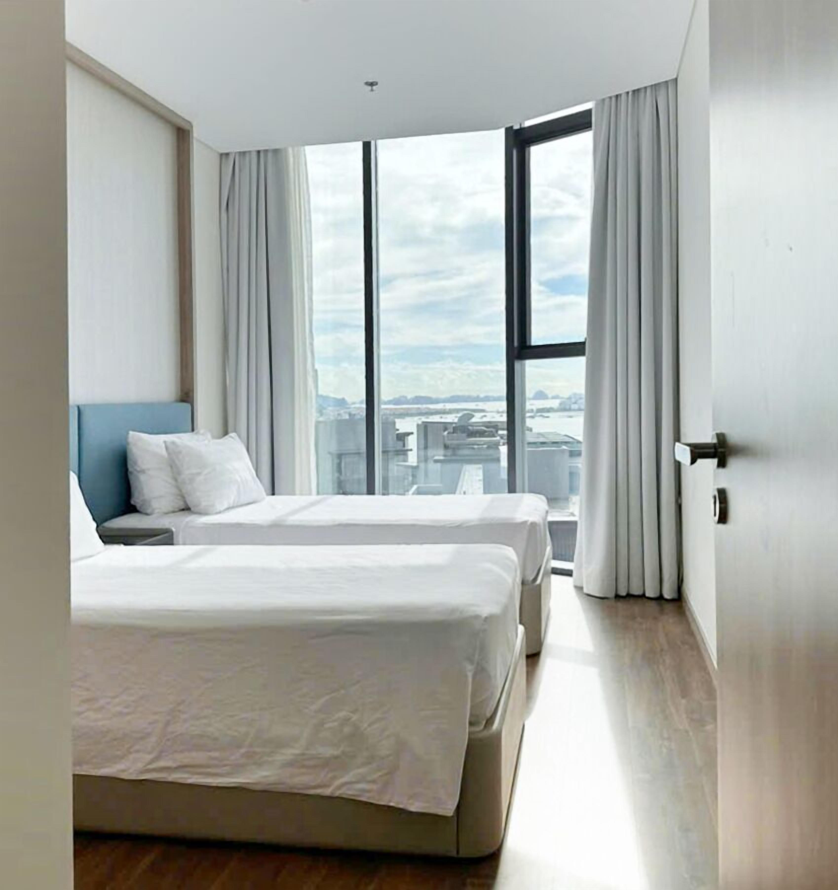 Apartamento premier, 2 quartos, sacada, vista para o mar | Cofres nos quartos, cortinas blackout, quartos à prova de som