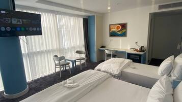 Family Triple Room, City View | Desk, laptop workspace, free WiFi