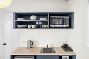 Fridge, microwave, toaster, cookware/dishes/utensils