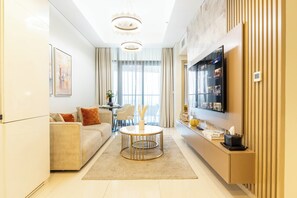 Deluxe Apartment, Balcony, City View | Living area | 50-cm Smart TV with cable channels - Keyrock Living - Stylish Dubai Stay (Dubai)