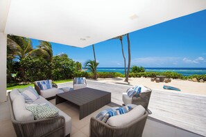 Terrace/patio - Olympus: Luxe Villa w/ Designer Pool, Private Beach & Rooftop Lounge w/ Panoramic Views (Grand Cayman)