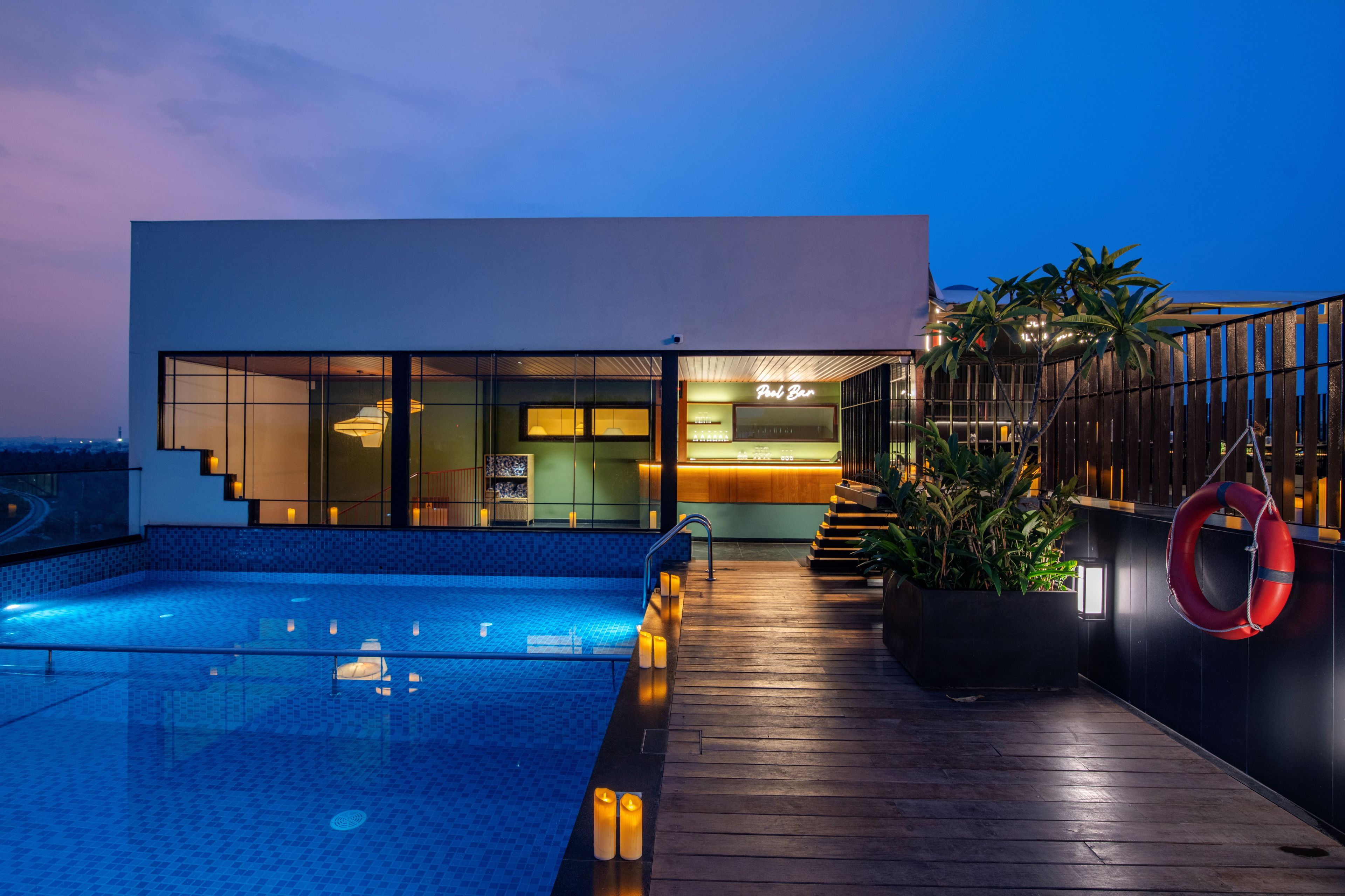 A modern building with a pool and a bar area.