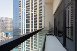 Deluxe Apartment, Balcony, City View | Living area | 50-cm Smart TV with digital channels