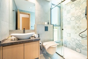 Shower, hair dryer, towels, soap