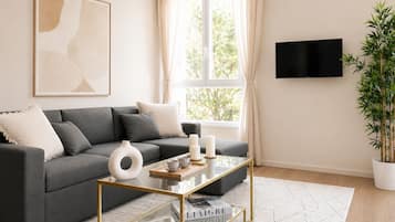 Appartement Familial, vue ville | Coin séjour | TV connectée de 80 cm avec chaînes numériques