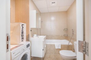 Shower, hair dryer, towels