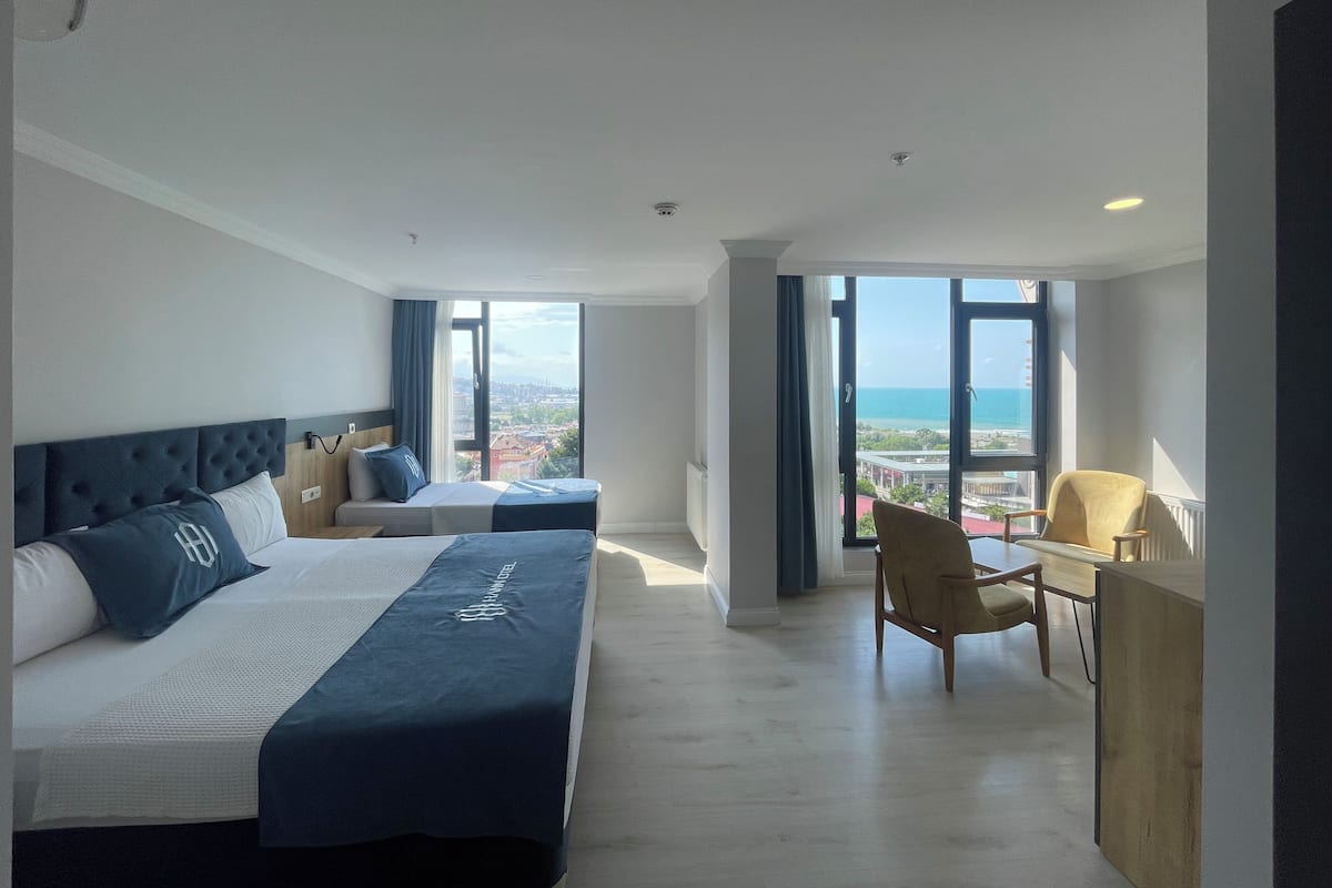 Triple Room, Sea View | Desk, laptop workspace, iron/ironing board, free WiFi