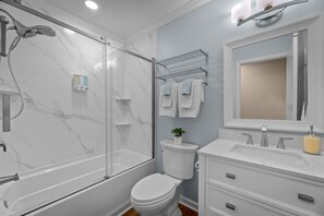 Shower, hair dryer, towels, soap