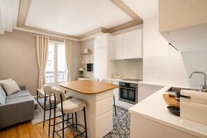 Superior Apartment, City View | Living area | 80-cm Smart TV with digital channels