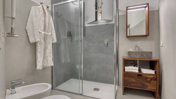 Junior Suite, Courtyard View | Bathroom | Bathrobes