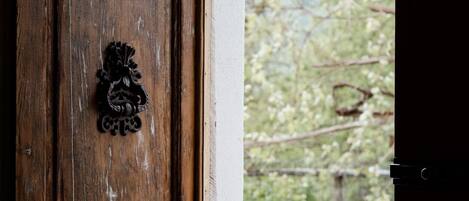 A wooden door with a metal knocker.