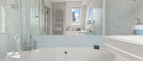 Shower, hair dryer, towels, shampoo